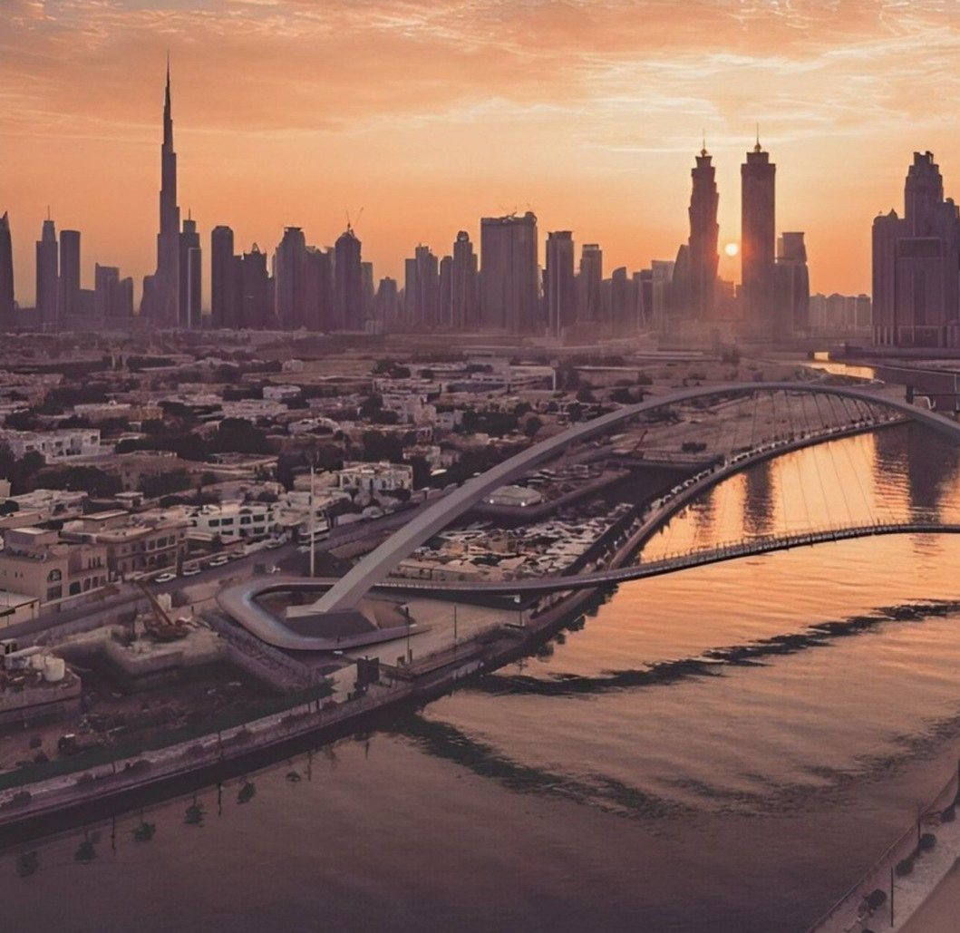 Dubai Water Canal and the Downtown Dubai skyline at sunset