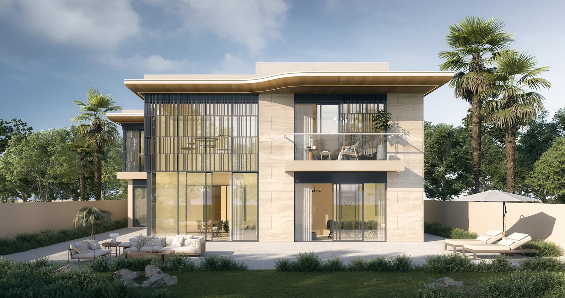 The garden elevation of a Talay Beach villa, with a terrace, pool deck and stone façade