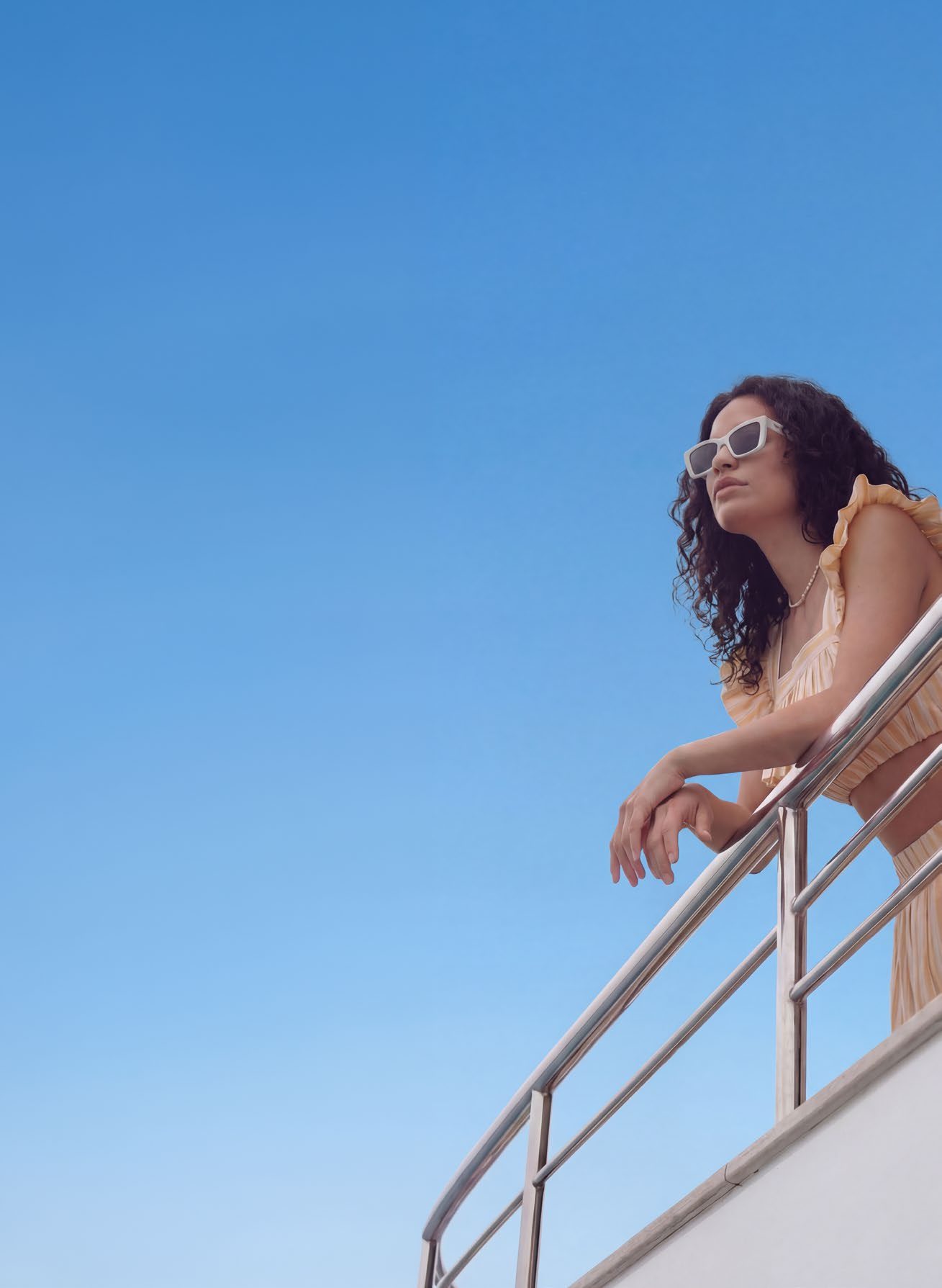 A guest on the deck of a yacht off Ramhan Island