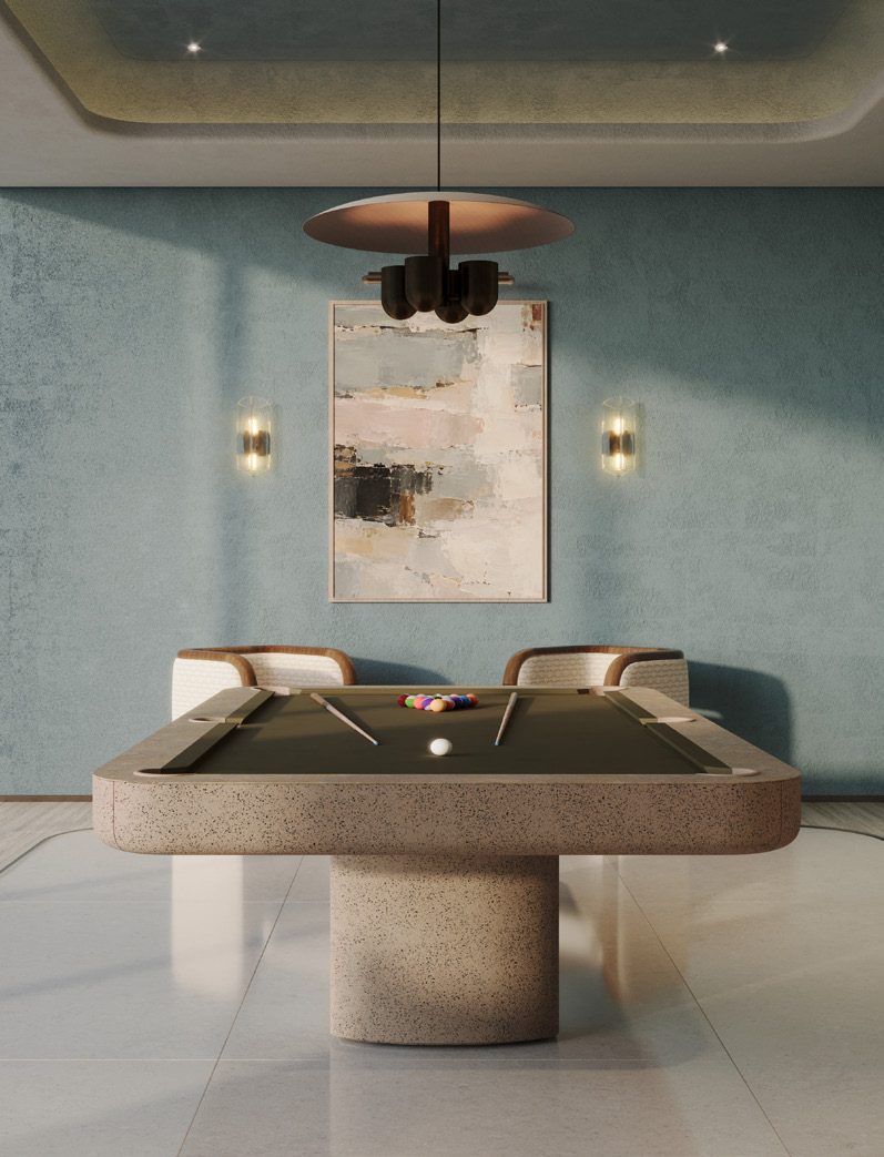 The games room with a pool table under a pendant lamp