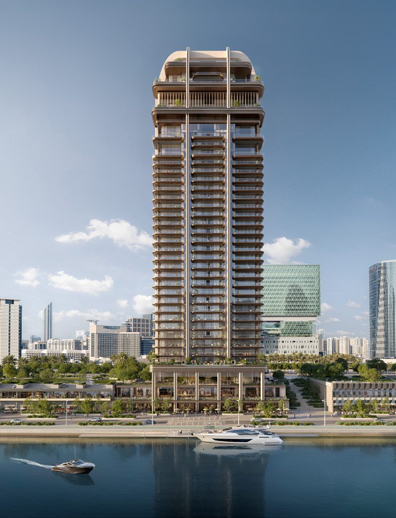 The Ritz-Carlton Residences tower rising above the Al Maryah Island promenade, with yachts on the water in front