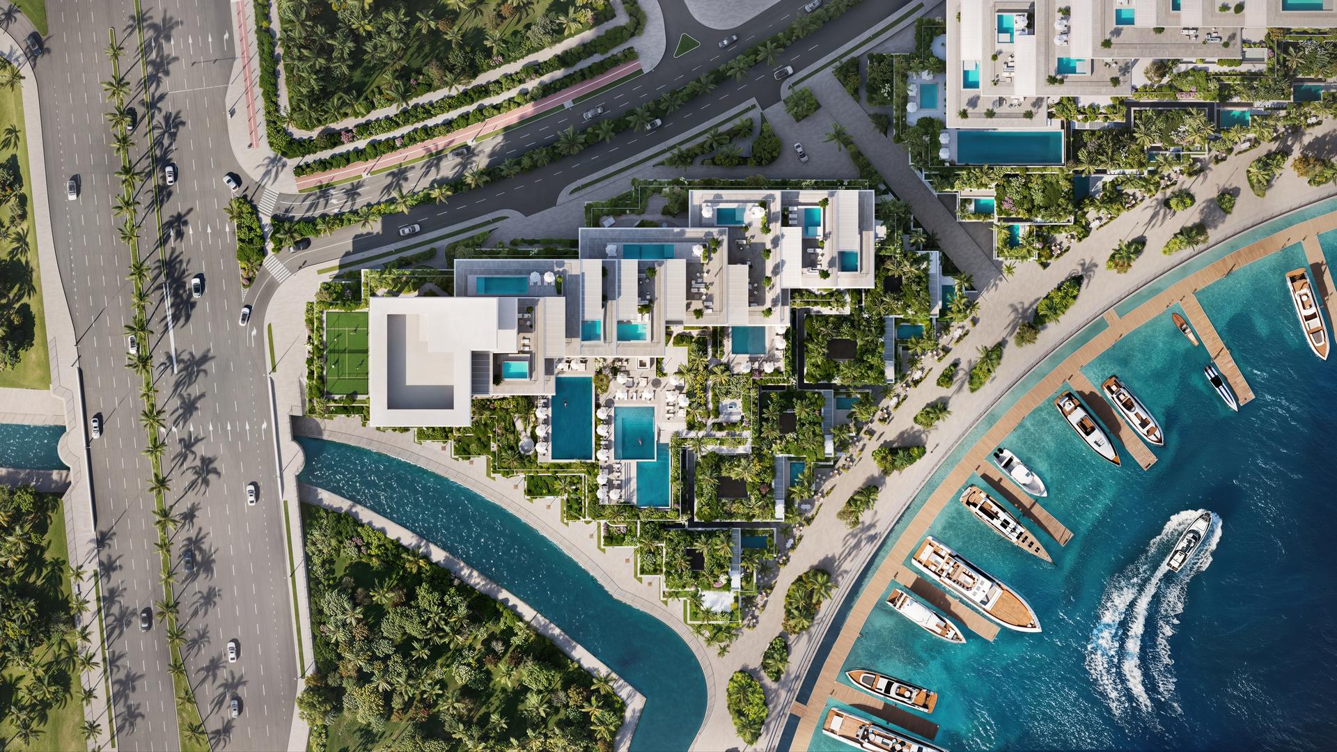 Aerial view of Riviera Residences, its pools and the private marina