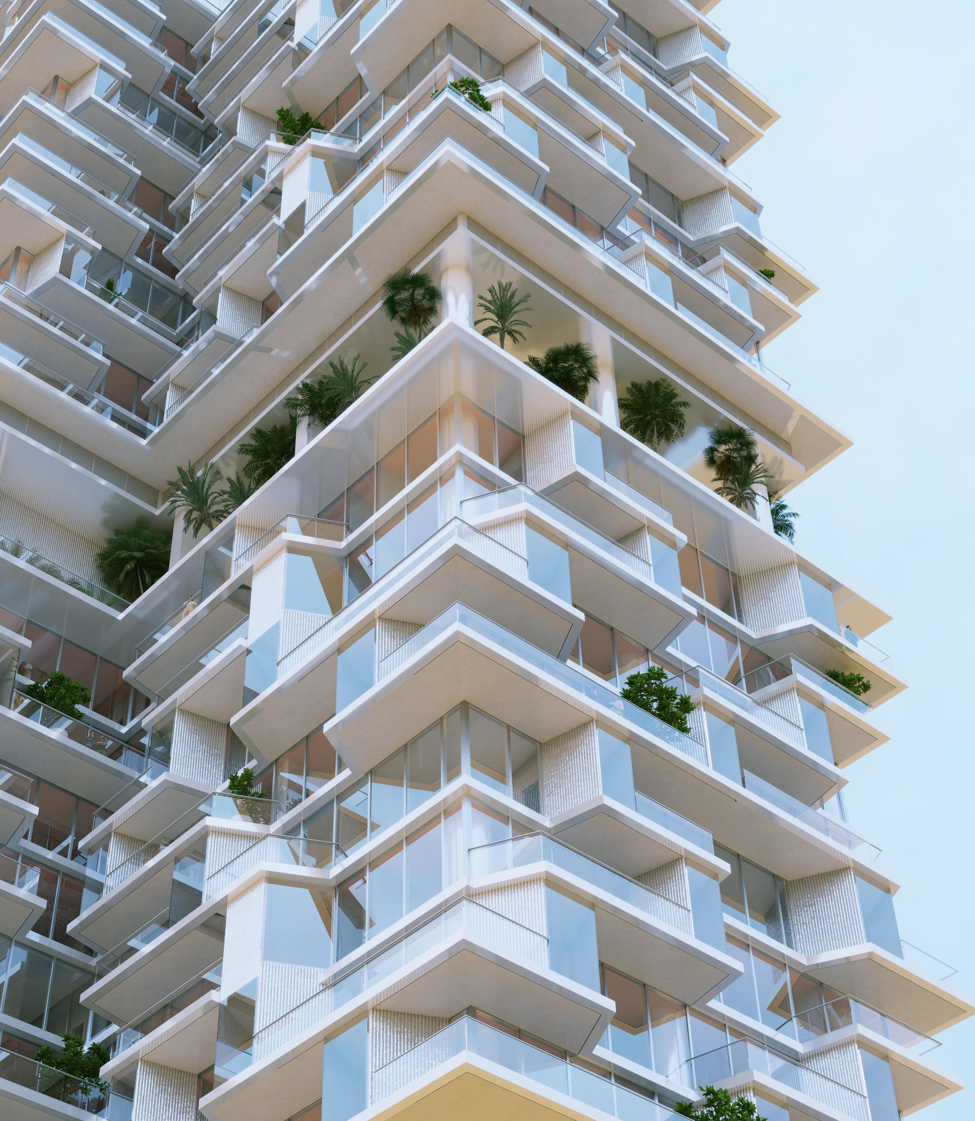 The mother-of-pearl façade of Riviera Residences at sunrise